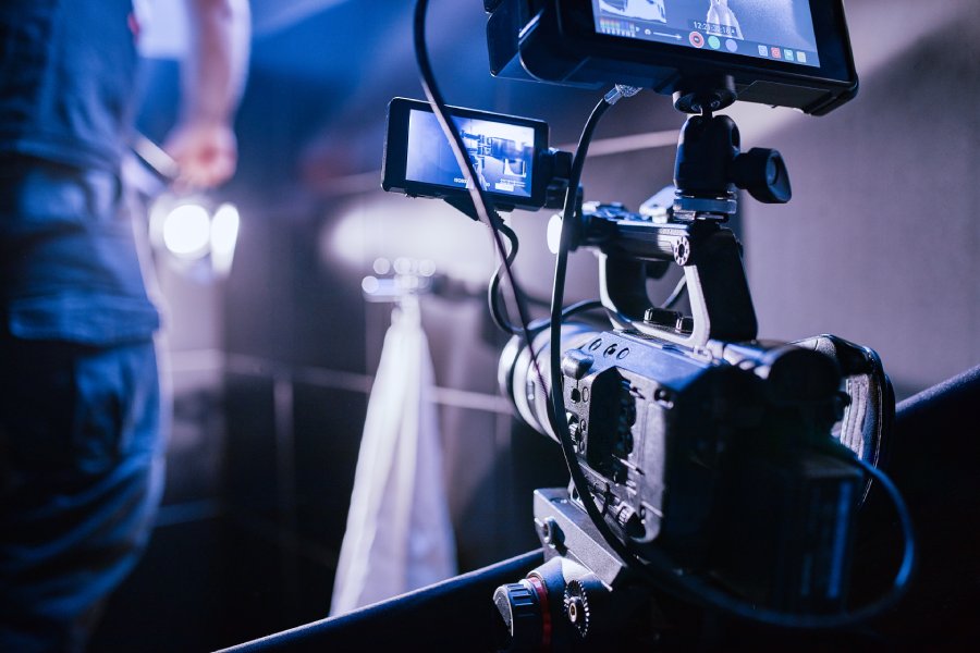 Behind the scenes of filming films or video products and the film crew of the film crew on the set in the pavilion of the film studio. Video Production Concept