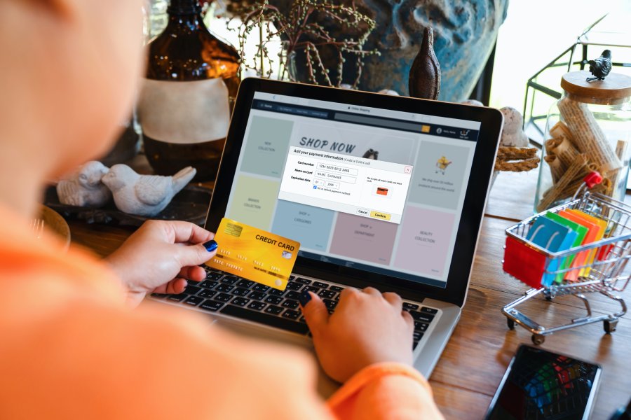 Online shopping, ecommerce, marketplace. Asian woman adding credit card information to account payment through laptop computer for online payments and shopping